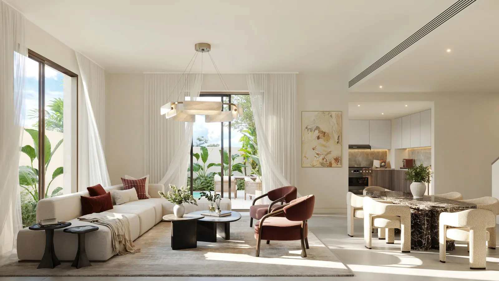 Dining and living area inside Yas Acres The Orchids Yas Island Abu Dhabi, offering seamless indoor‑outdoor flow and refined modern design.