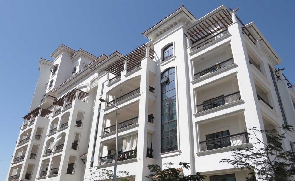Ansam Residences Yas Island apartment balconies overlooking golf course and green landscaped gardens