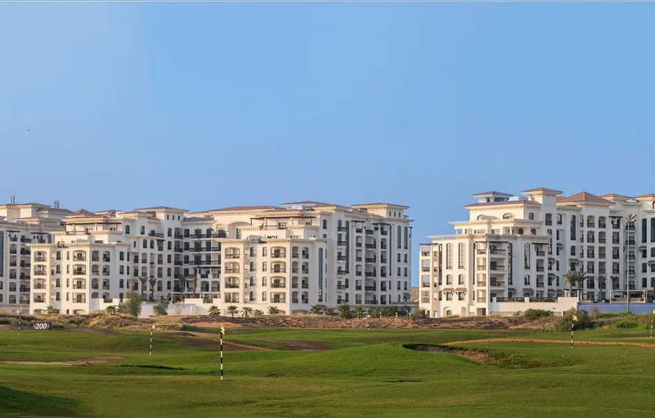 Ansam Yas Island community aerial view with golf course and waterfront in Abu Dhabi