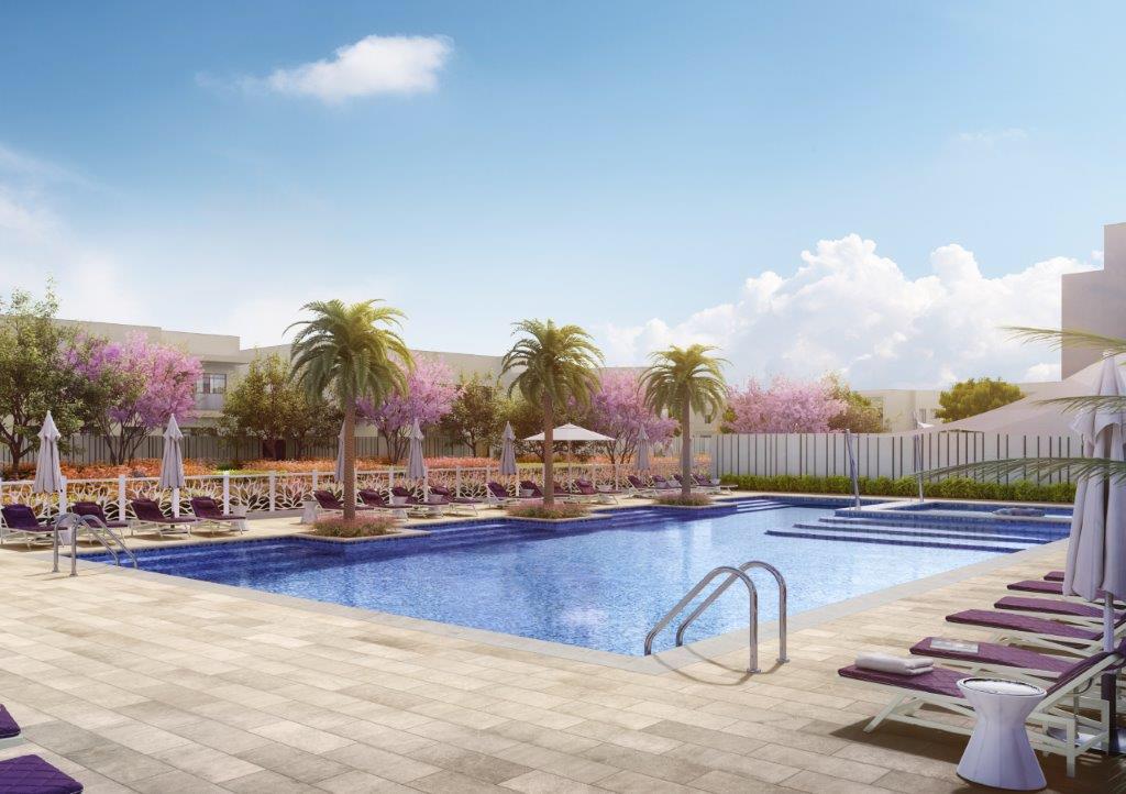 Spacious open-plan living and dining area with modern interiors in LEA Yas Island villas by Aldar.