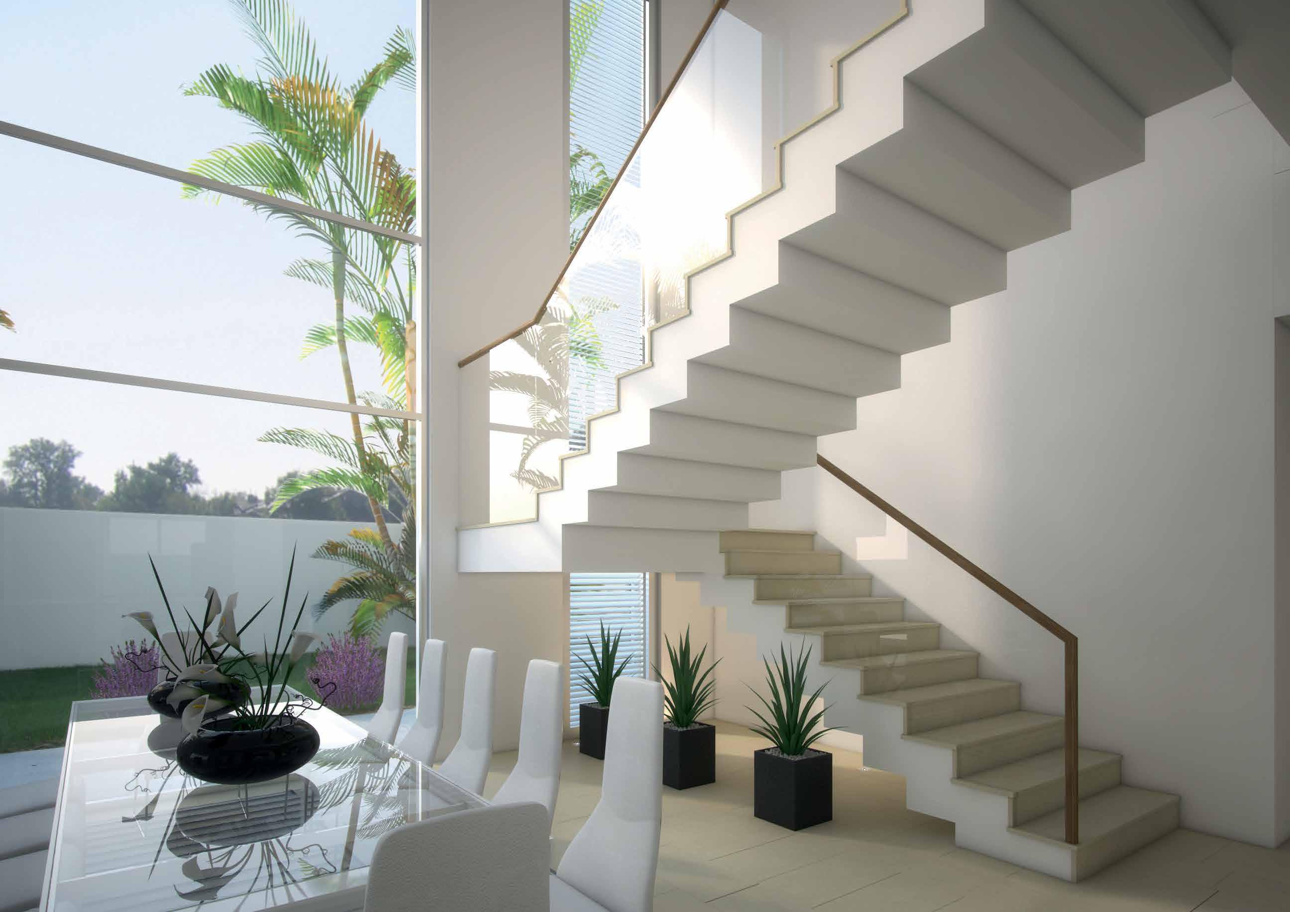 Contemporary dining area in West Yas villa, Yas Island, Abu Dhabi with family table and garden access