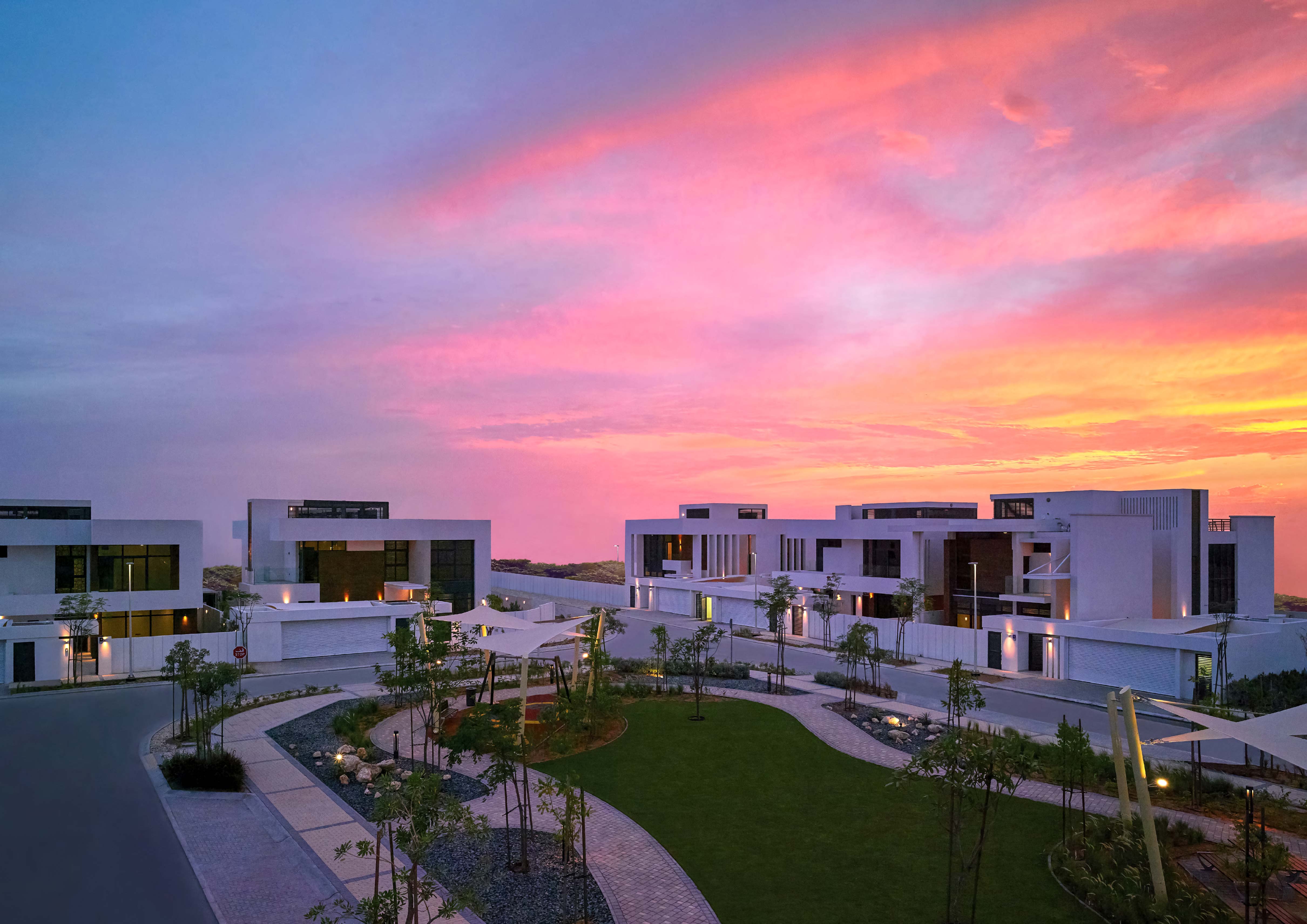 Aerial view of West Yas villas along the mangrove waterfront in Yas Island, Abu Dhabi showing rows of premium villas and green spaces