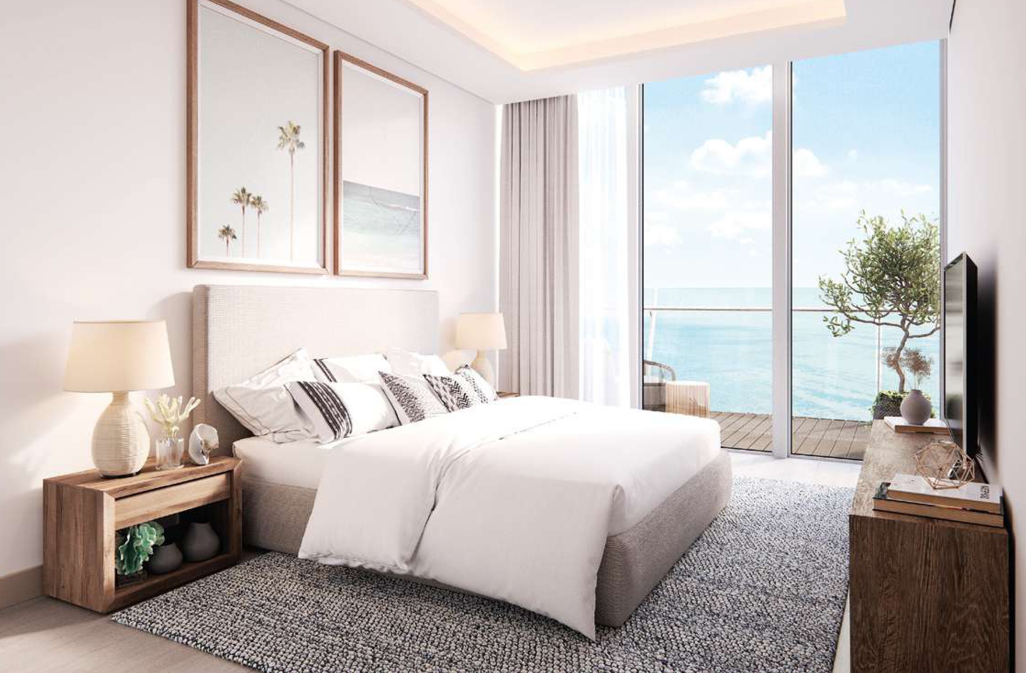 Open-concept living area extending into a kitchen zone, with panoramic windows to the right and streamlined furniture, showcasing a cohesive and modern home layout
