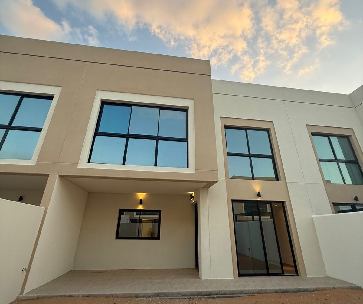 Elegant townhouse exterior at The Magnolias Yas Acres Abu Dhabi showcasing contemporary façade, landscaped surroundings, and upscale residential appeal.
