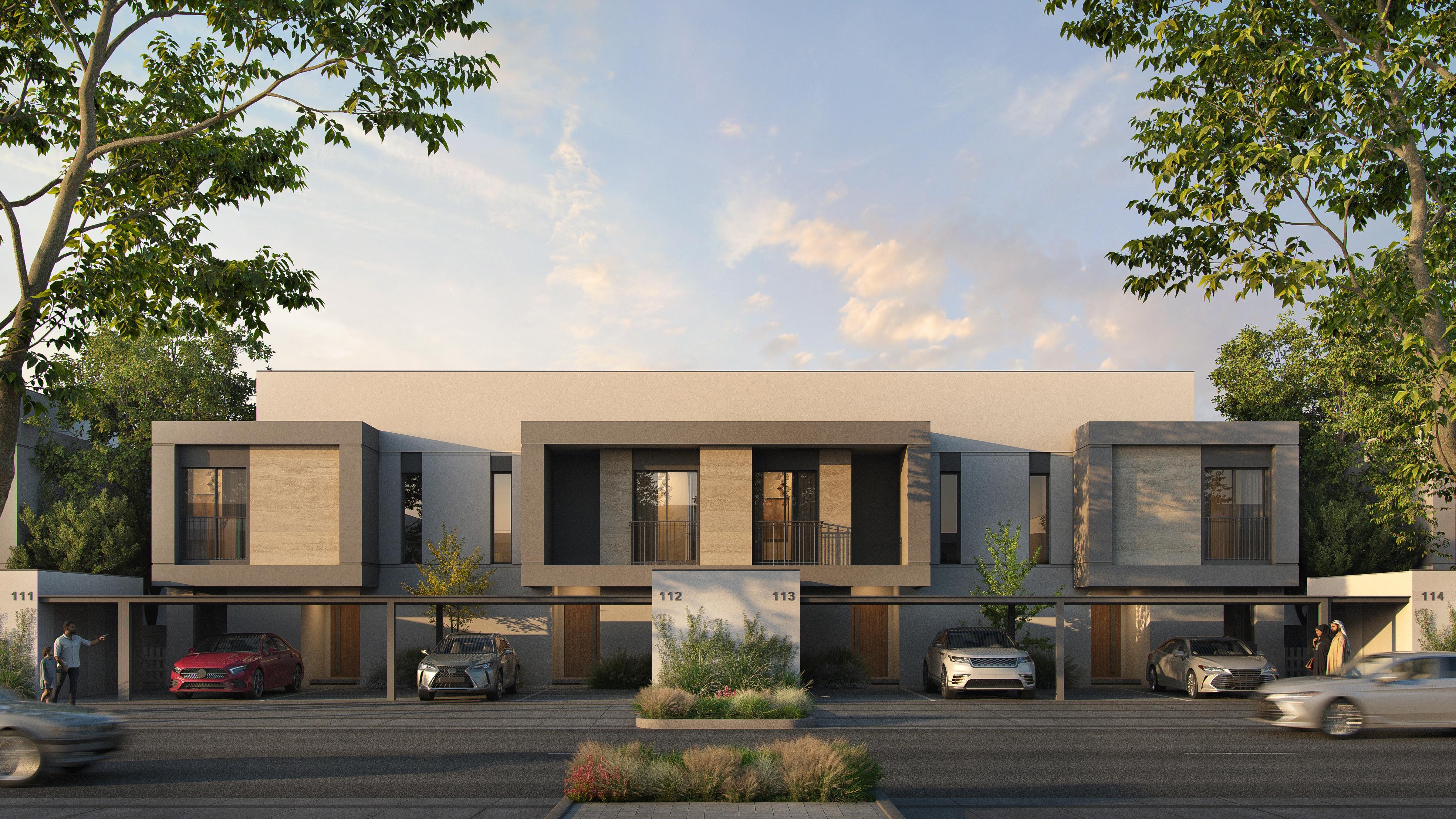 Exterior view of Yas Acres The Orchids Yas Island Abu Dhabi, showcasing elegant architecture surrounded by lush landscaped greenery and open community spaces.
